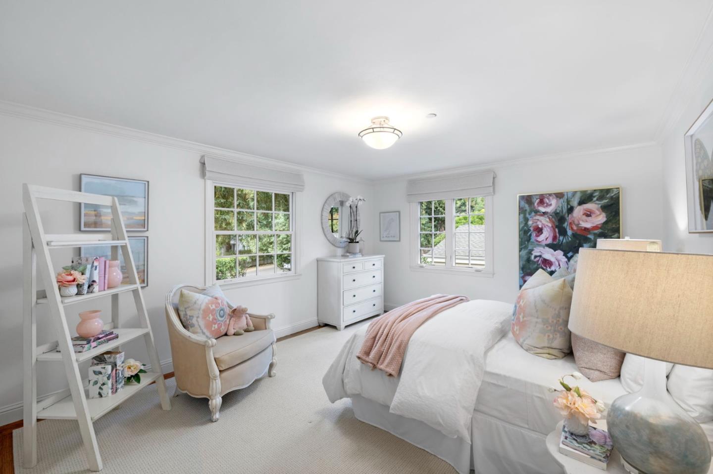 310 Ranelagh Road Hillsborough, CA 94010 - Photo 32 of 51 a spacious bedroom with a bed and a couch