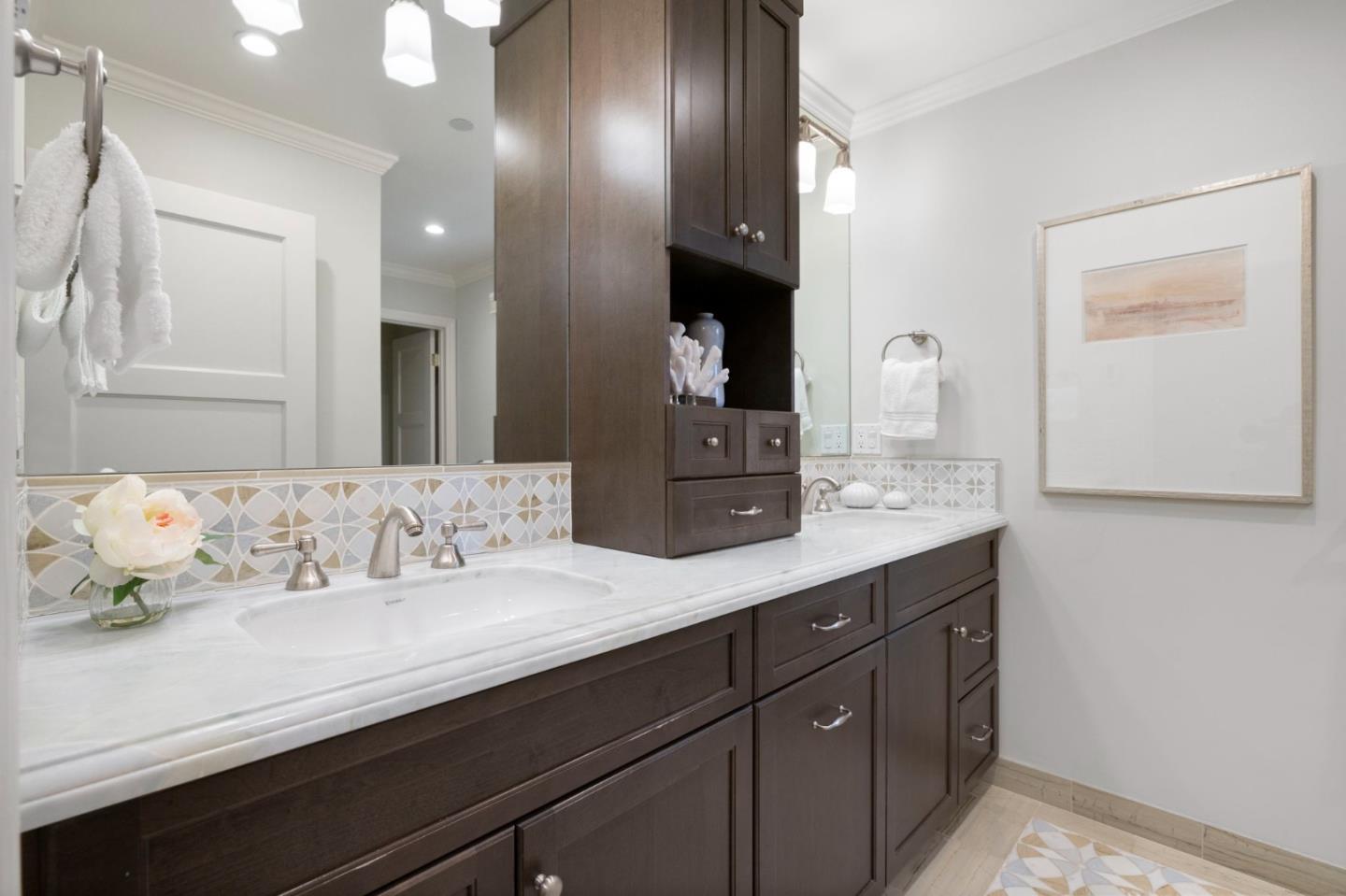 310 Ranelagh Road Hillsborough, CA 94010 - Photo 34 of 51 a bathroom with a sink double vanity and a mirror