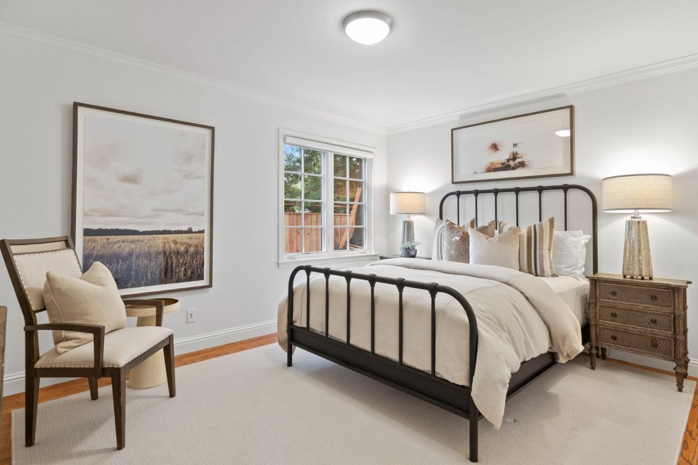 310 Ranelagh Road Hillsborough, CA 94010 - Photo 38 of 51 a bed sitting in a bedroom next to a window