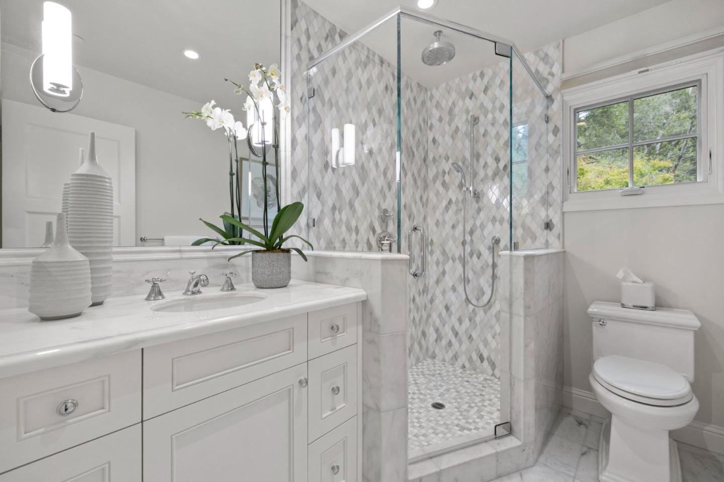310 Ranelagh Road Hillsborough, CA 94010 - Photo 40 of 51 a bathroom with a sink a toilet and shower
