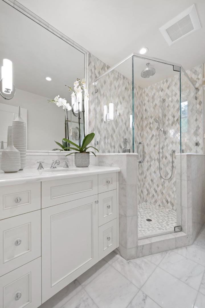 310 Ranelagh Road Hillsborough, CA 94010 - Photo 41 of 51 a bathroom with a shower sink and mirror