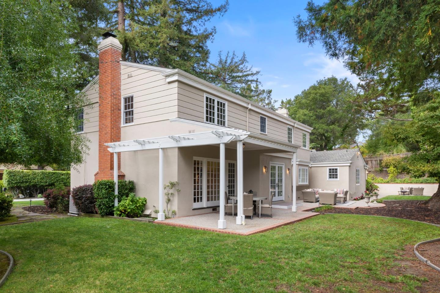 310 Ranelagh Road Hillsborough, CA 94010 - Photo 47 of 51 a view of a house with backyard porch and sitting area