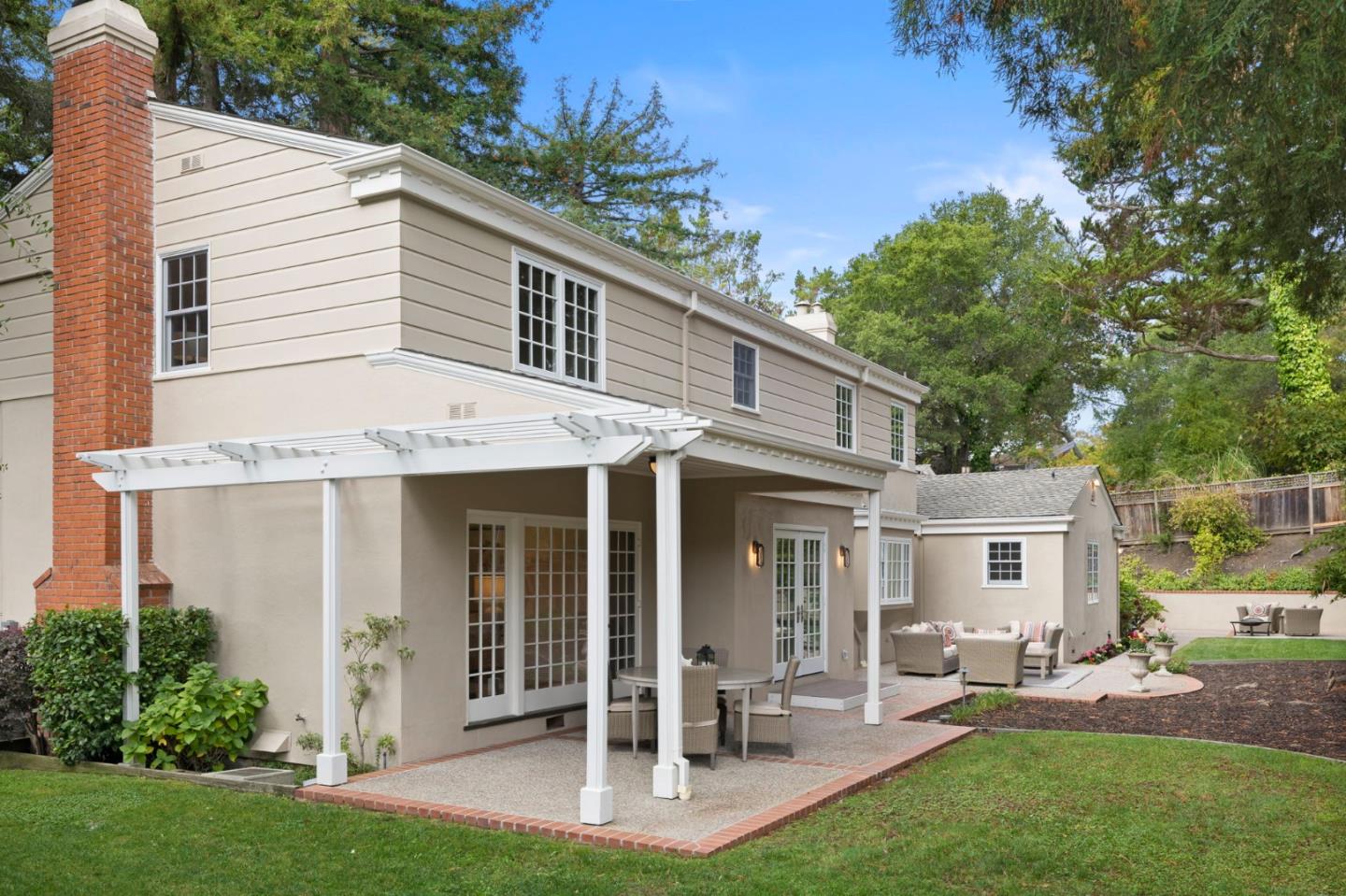 310 Ranelagh Road Hillsborough, CA 94010 - Photo 49 of 51 a view of a house with a yard and sitting area