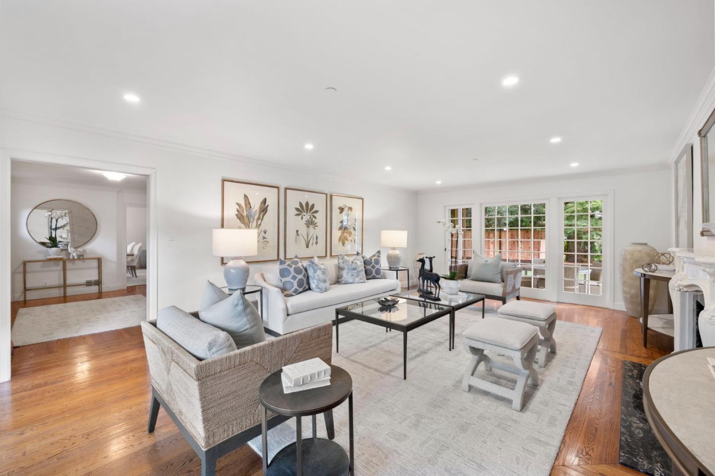 310 Ranelagh Road Hillsborough, CA 94010 - Photo 7 of 51 a living room with fireplace furniture and a wooden floor