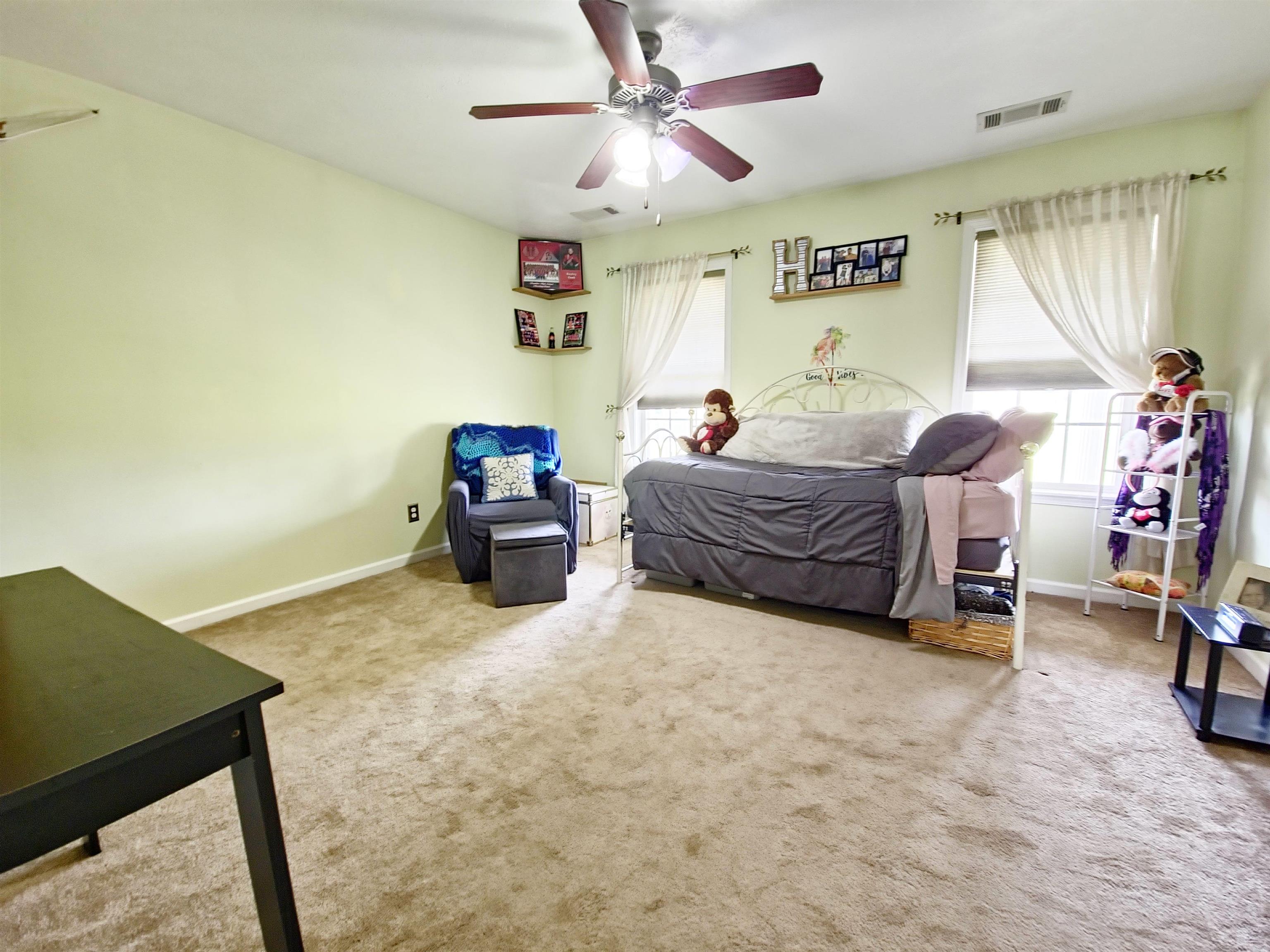 313 Rembert Drive Atoka, TN 38004 - Photo 7 of 19 Carpeted bedroom with ceiling fan