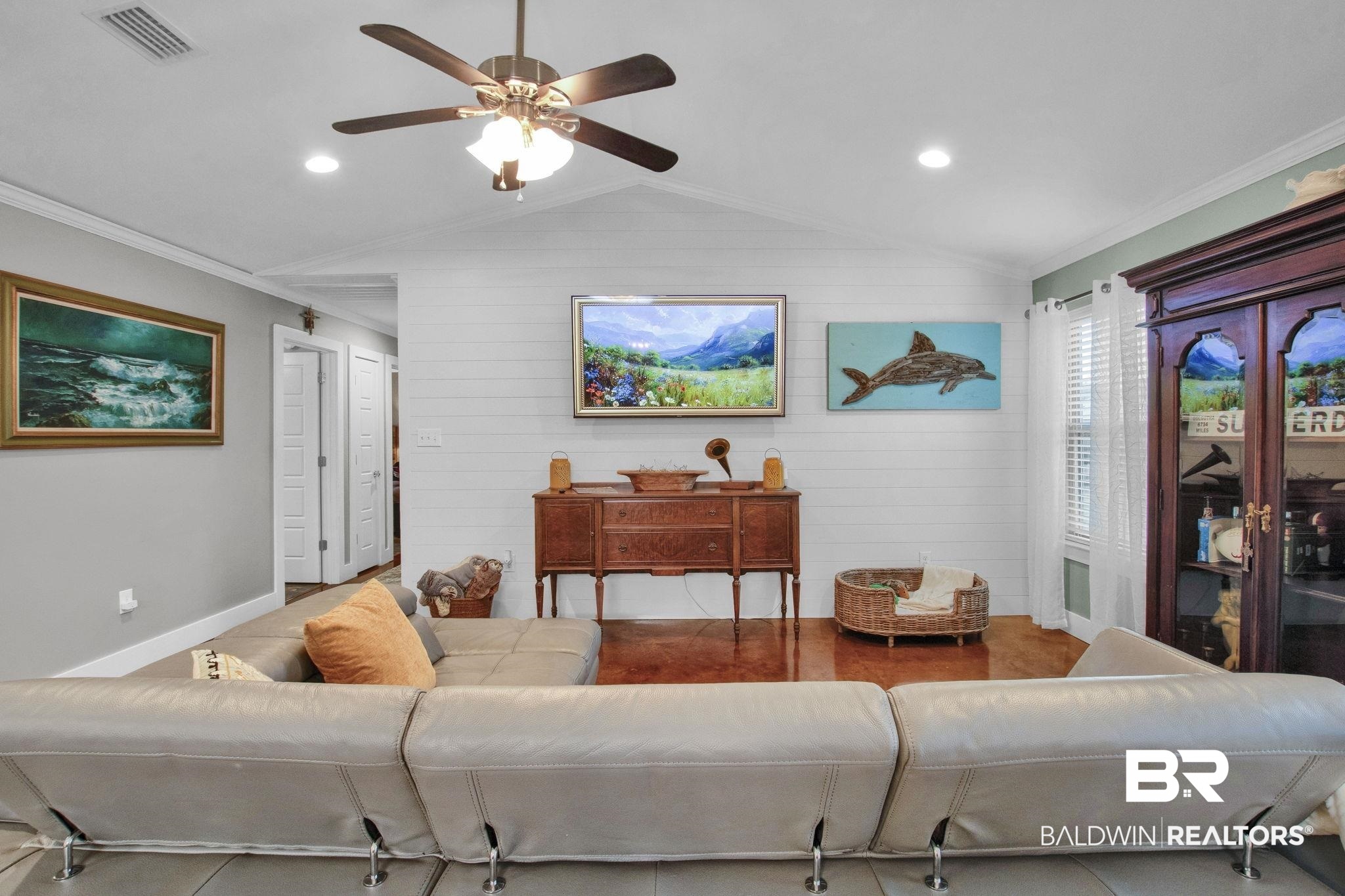 203 Lakefront Circle Summerdale, AL 36580 - Photo 19 of 69 Living room featuring ceiling fan, ornamental molding, and vaulted ceiling