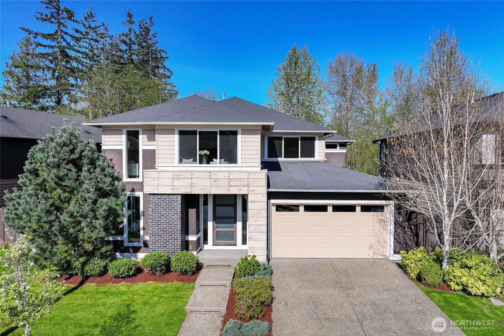 17002 40th Avenue Southeast Bothell, WA 98012 - Photo 1 of 1 a front view of a house with a garden and trees