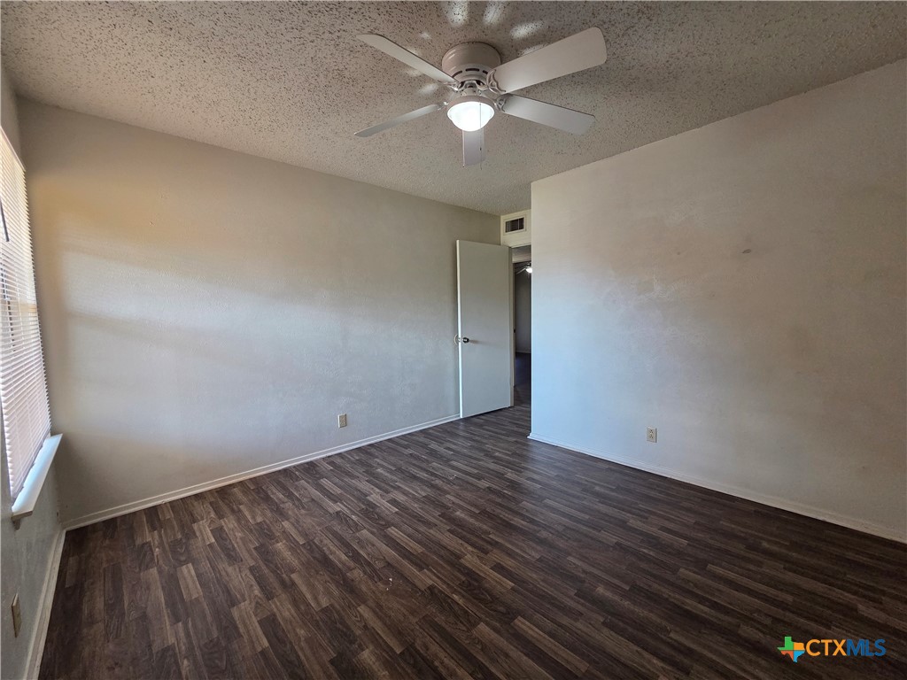 1802 Azalea Drive Temple, TX 76502 - Photo 14 of 21 wooden floor in an empty room with a window