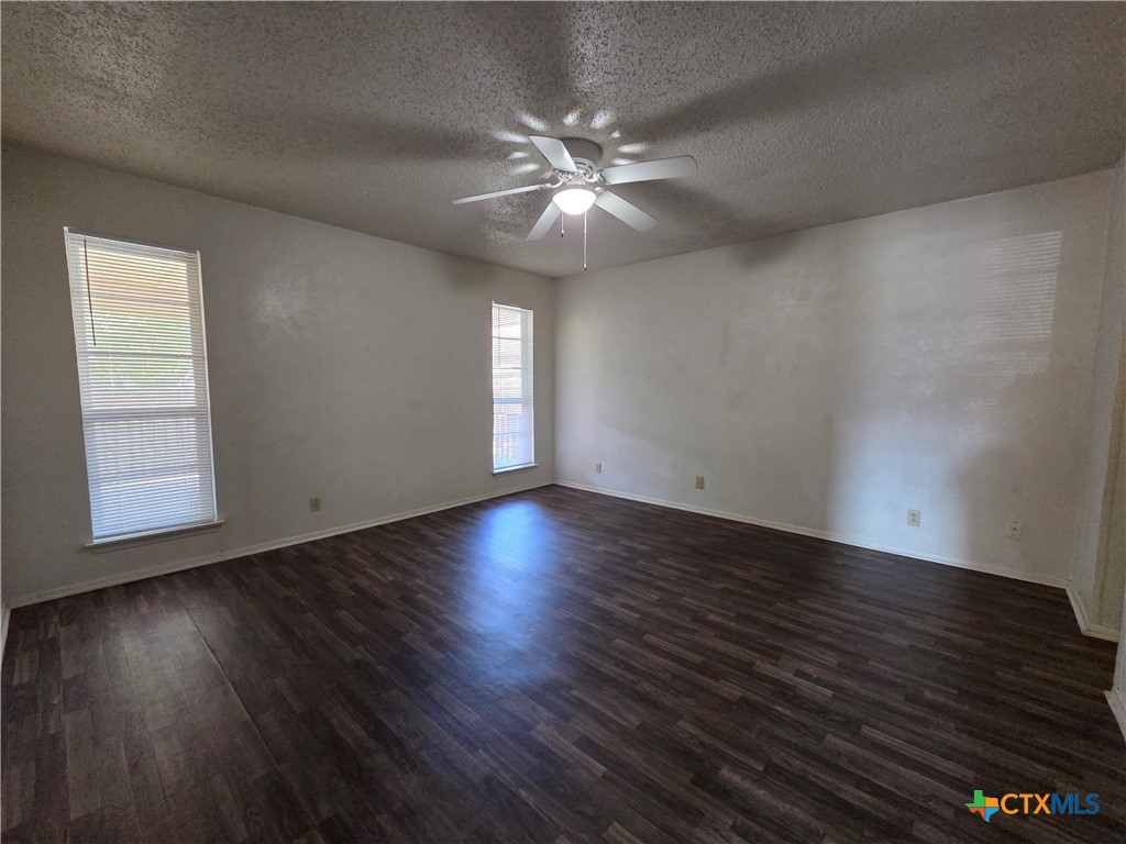 1802 Azalea Drive Temple, TX 76502 - Photo 15 of 21 a view of an empty room with wooden floor and a window