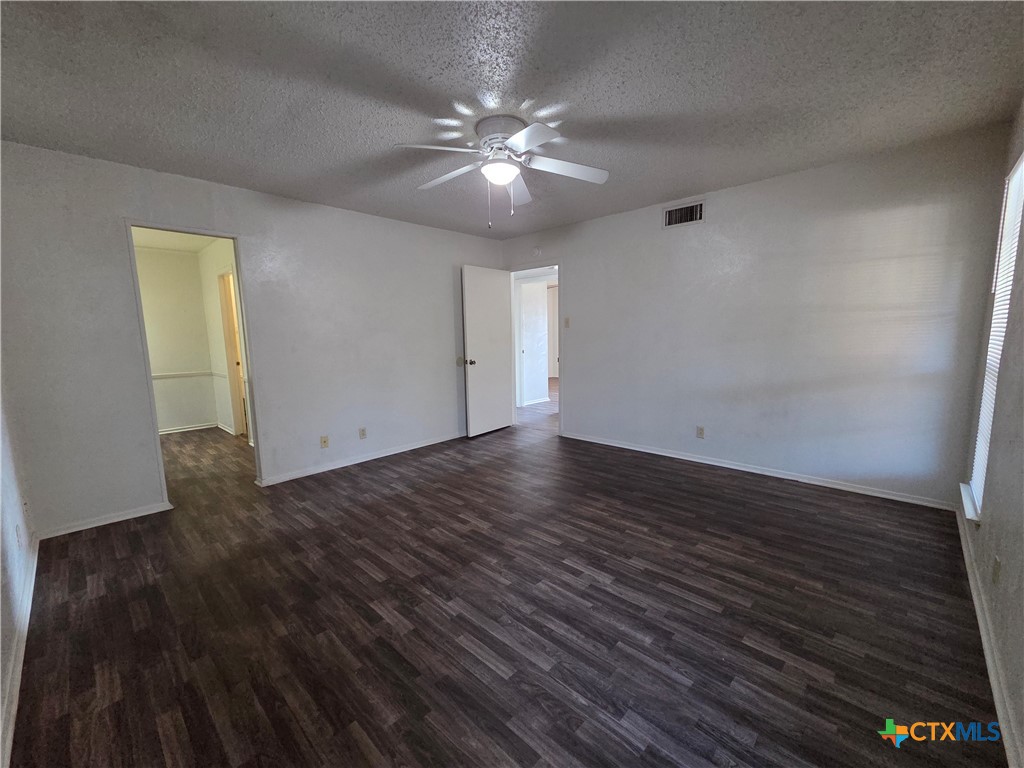 1802 Azalea Drive Temple, TX 76502 - Photo 16 of 21 a view of a room with wooden floor and chandelier fan