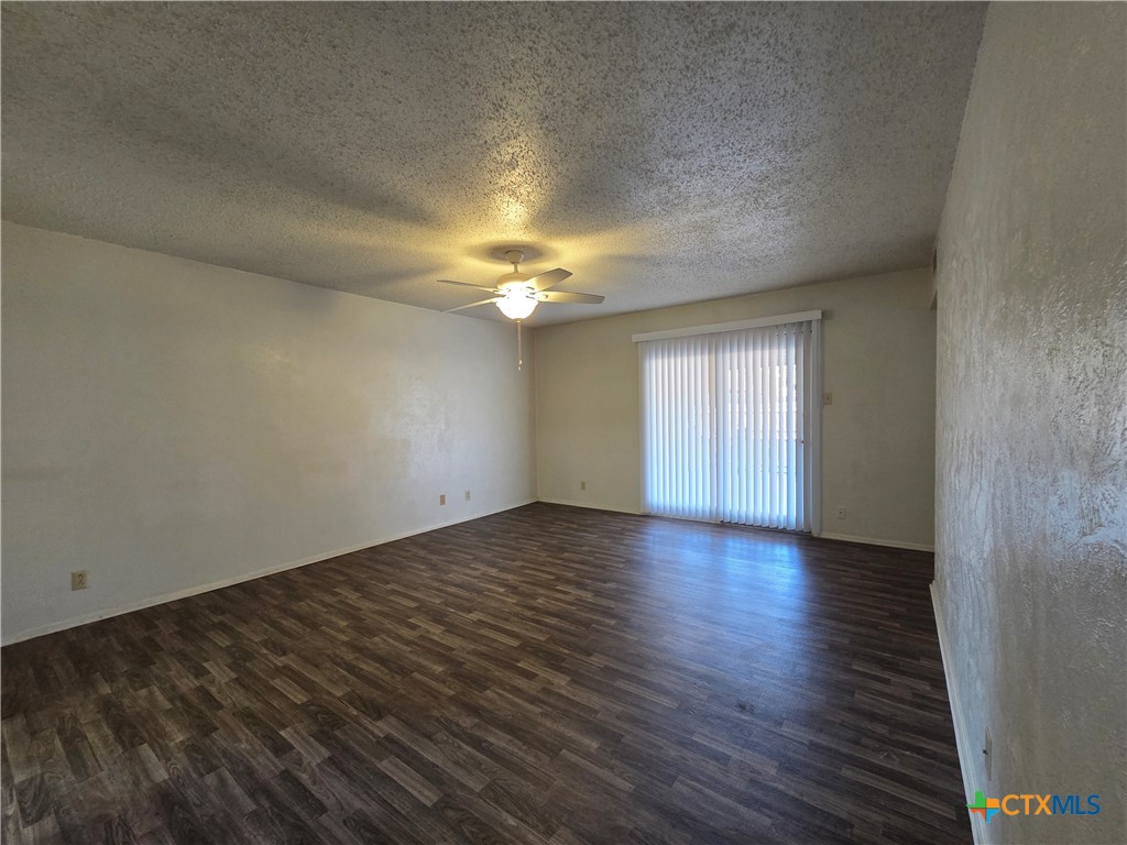1802 Azalea Drive Temple, TX 76502 - Photo 3 of 21 an empty room with wooden floor and windows