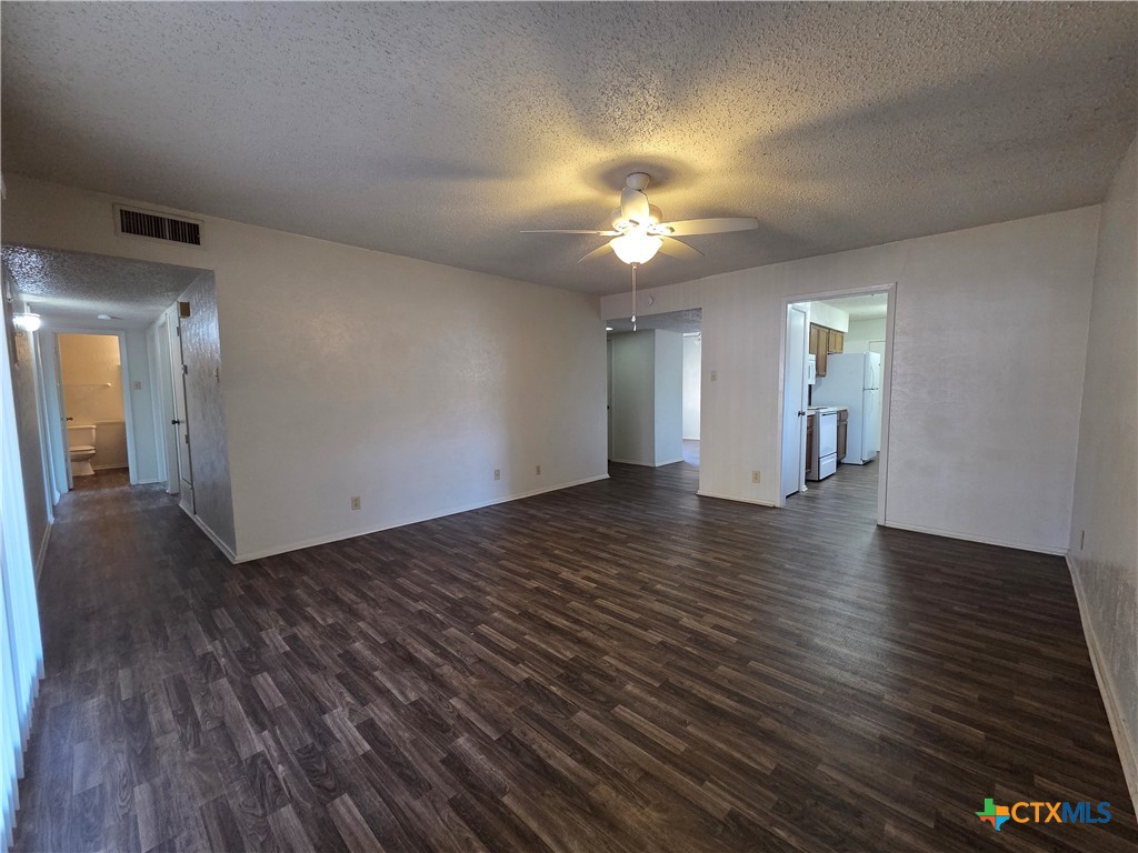 1802 Azalea Drive Temple, TX 76502 - Photo 4 of 21 wooden floor in an empty room with a window