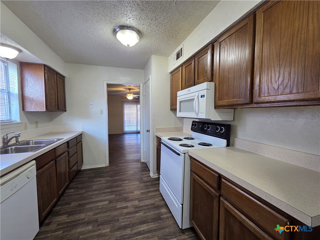 1802 Azalea Drive Temple, TX 76502 - Photo 7 of 21 a kitchen with a stove and a sink