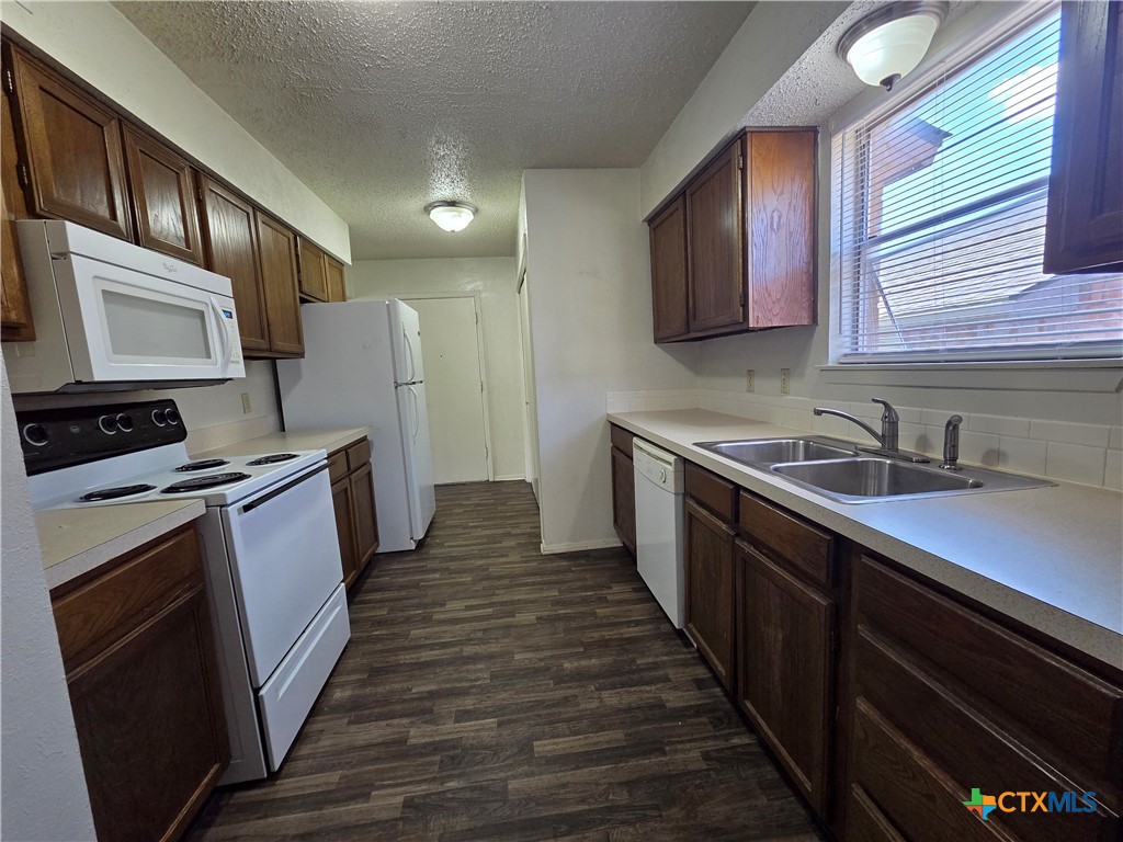 1802 Azalea Drive Temple, TX 76502 - Photo 8 of 21 a kitchen with sink cabinets and stainless steel appliances