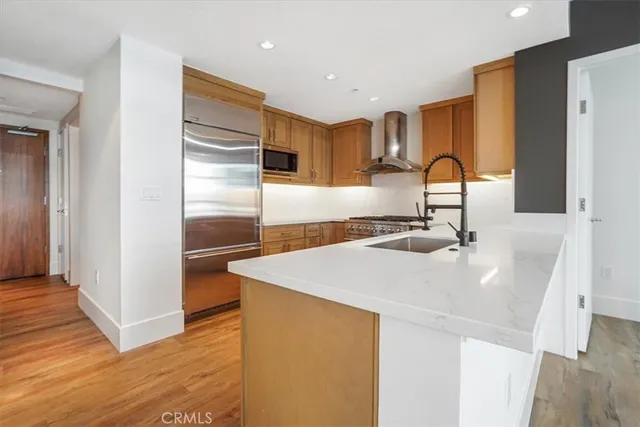 a bathroom with a tub a sink and a mirror