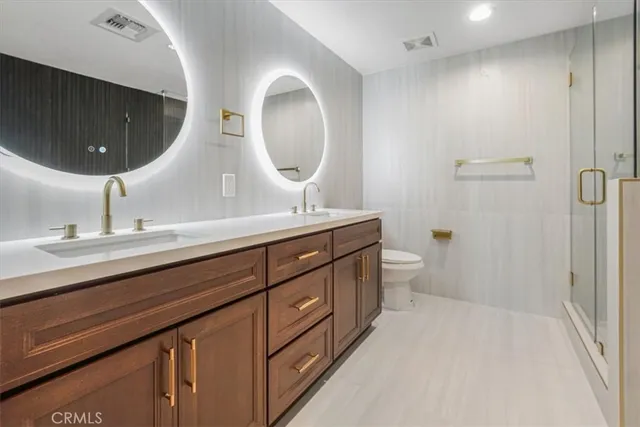 a spacious bathroom with a tub sink and mirror