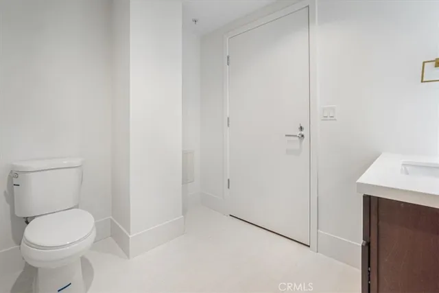 a view of a hallway with wooden shelves