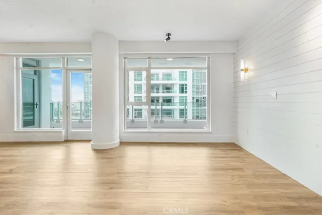 a view of room with hardwood floor and cabinet
