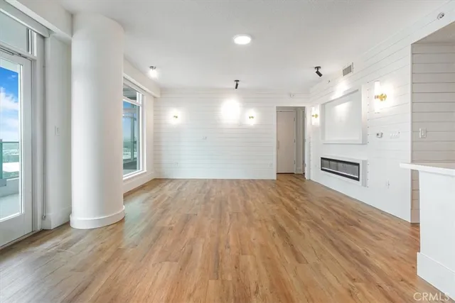 a view of a kitchen cabinets and wooden floor