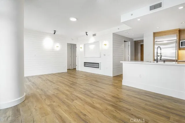 a living room with furniture and chandelier