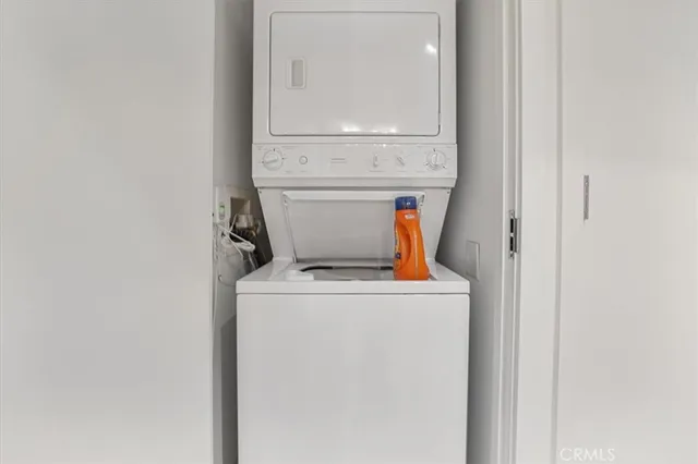 a living room with furniture wooden floor and a large window