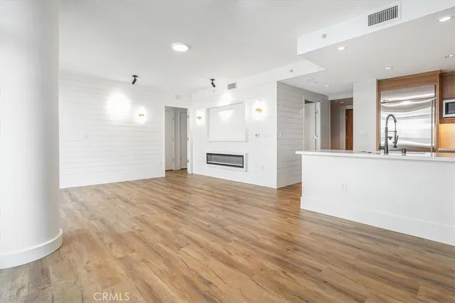 a kitchen with cabinets a sink and appliances