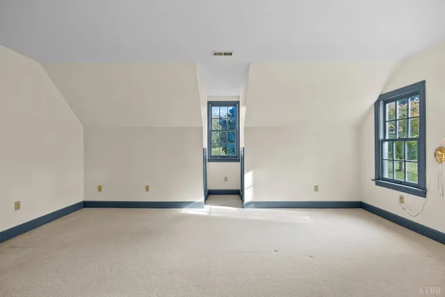 a front view of a house with a big yard