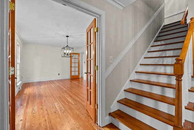 a view of a room with wooden floor and windows