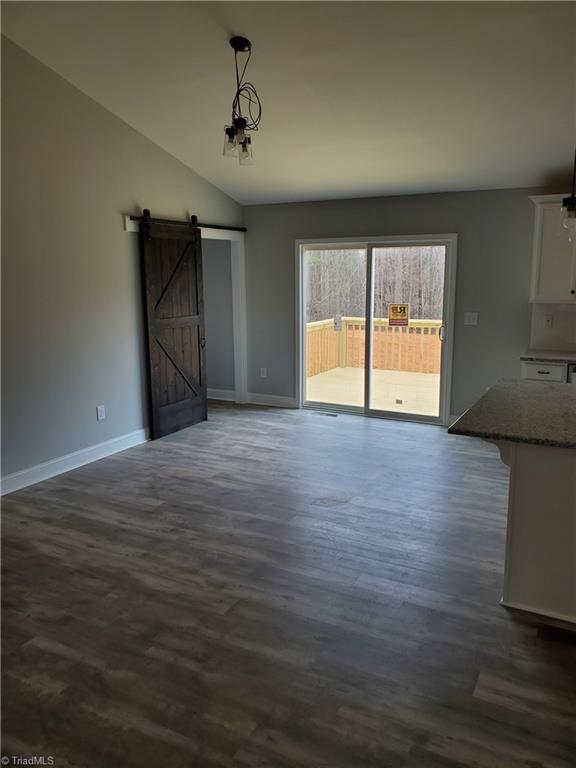 524 Price Farm Road Stokesdale, NC 27357 - Photo 4 of 8 Dining Area with Barn Door to Laundry Area