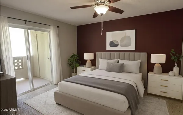 a bedroom with a large bed and a window