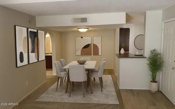 a view of a dining room with furniture and window