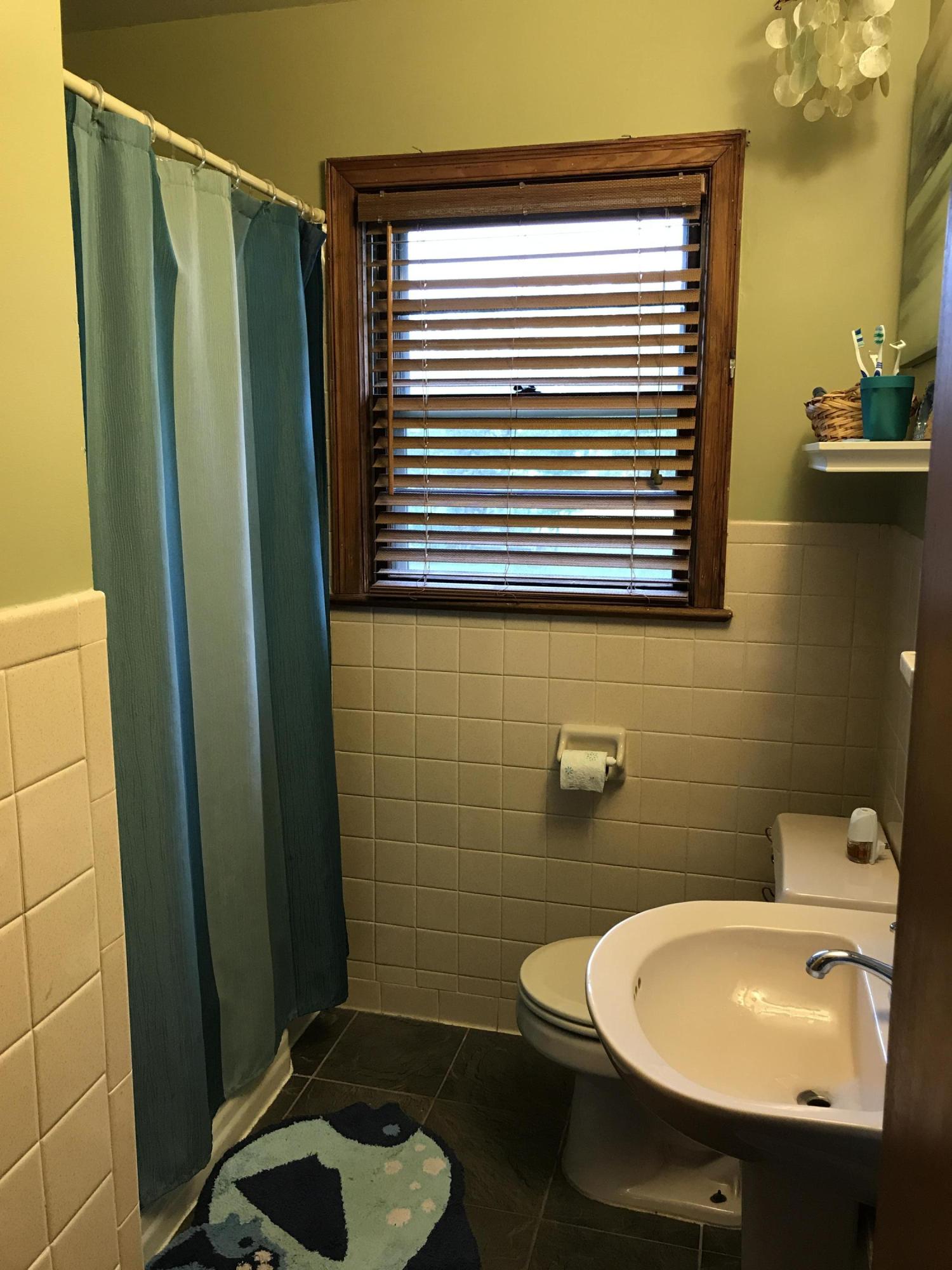 5108 Hazelridge Road Northwest Roanoke, VA 24012 - Photo 14 of 24 a bathroom with a sink a toilet and shower