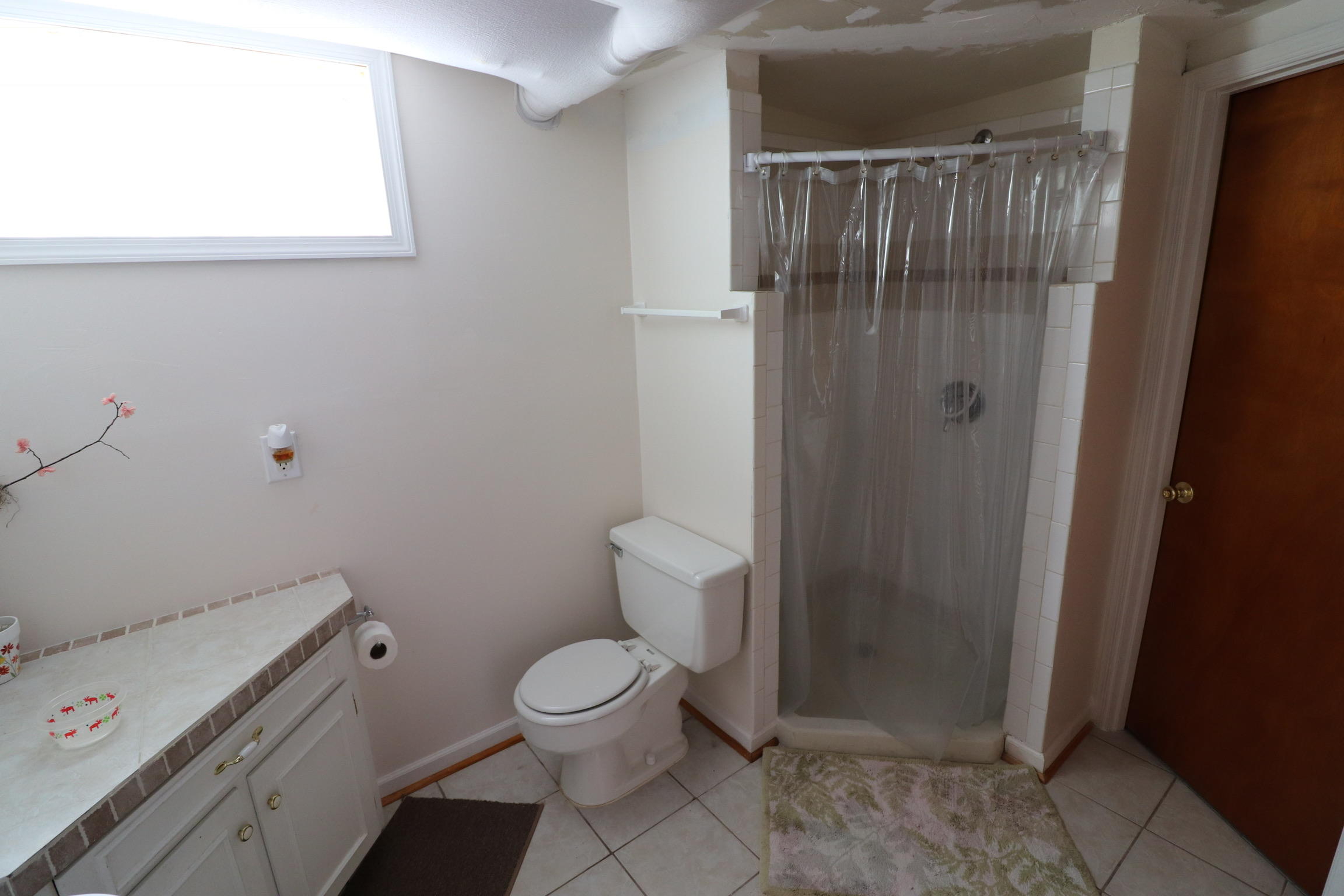 5108 Hazelridge Road Northwest Roanoke, VA 24012 - Photo 20 of 24 a white toilet sitting next to a bathroom sink