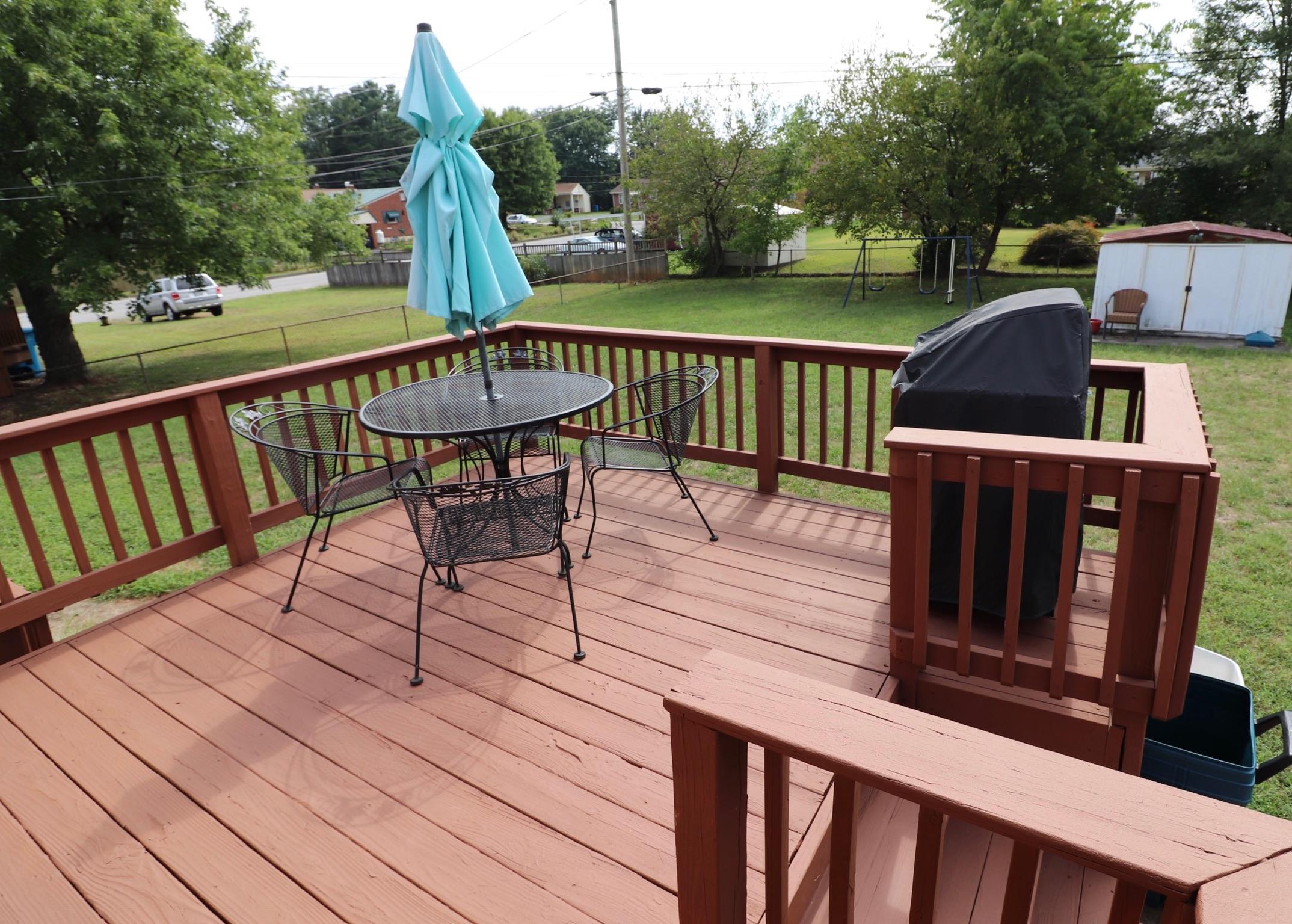 5108 Hazelridge Road Northwest Roanoke, VA 24012 - Photo 23 of 24 a view of a deck with two chair and wooden floor