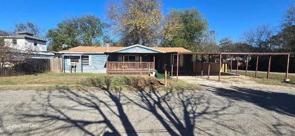 a house with trees in the background