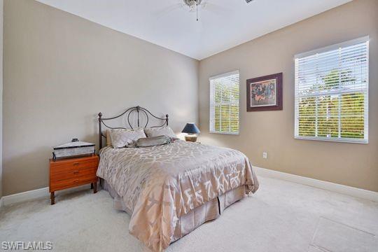 19600 Marino Lake Circle, Unit 3003 Fort Myers, FL 33913 - Photo 18 of 28 a bedroom with a bed and a window
