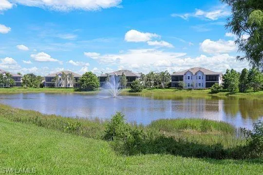 a view of a lake with houses in the back