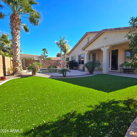 a front view of house with yard and outdoor seating