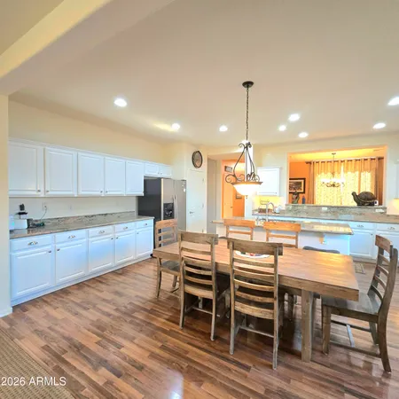 a kitchen with a table chairs stove and microwave