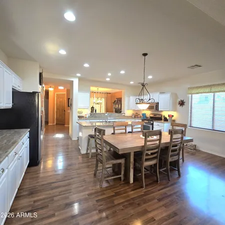 a view of a dining area with furniture window and wooden floor