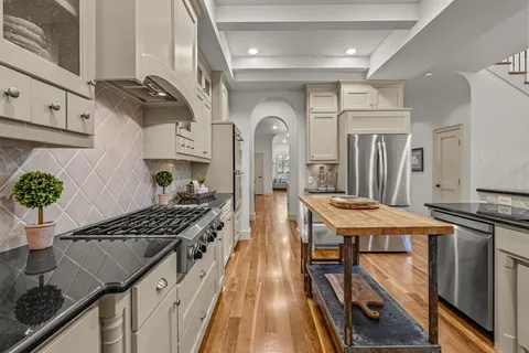 a kitchen with a table and chairs in it