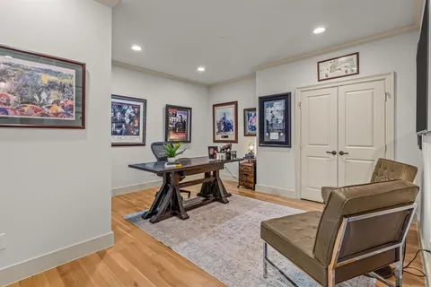 a spacious bedroom with a bed and a window