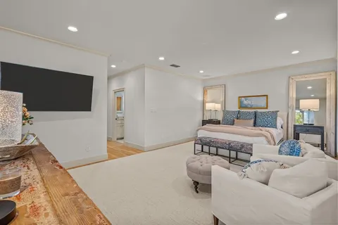 a bathroom with a granite countertop sink mirror and bathtub