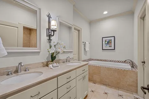 a bathroom with a sink vanity and a mirror