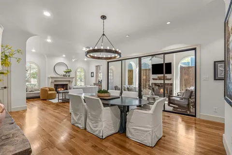 a living room with fireplace furniture and a flat screen tv