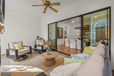 a view of a dining room with furniture wooden floor and chandelier