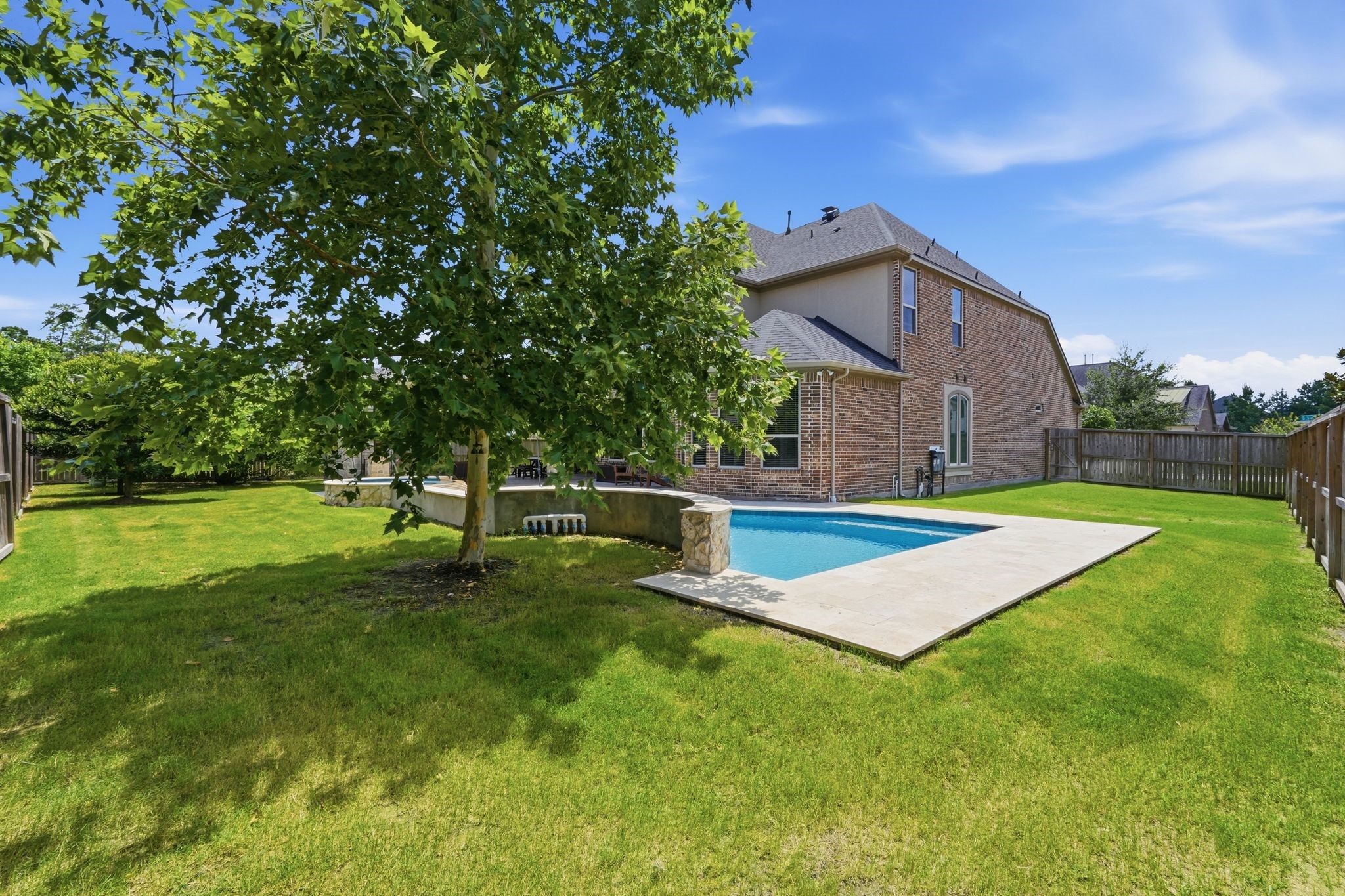 27705 South Slate Hills Lane Spring, TX 77386 - Photo 38 of 45 Beautifully manicured lawn shaded by a large Mexican Sycamore tree.