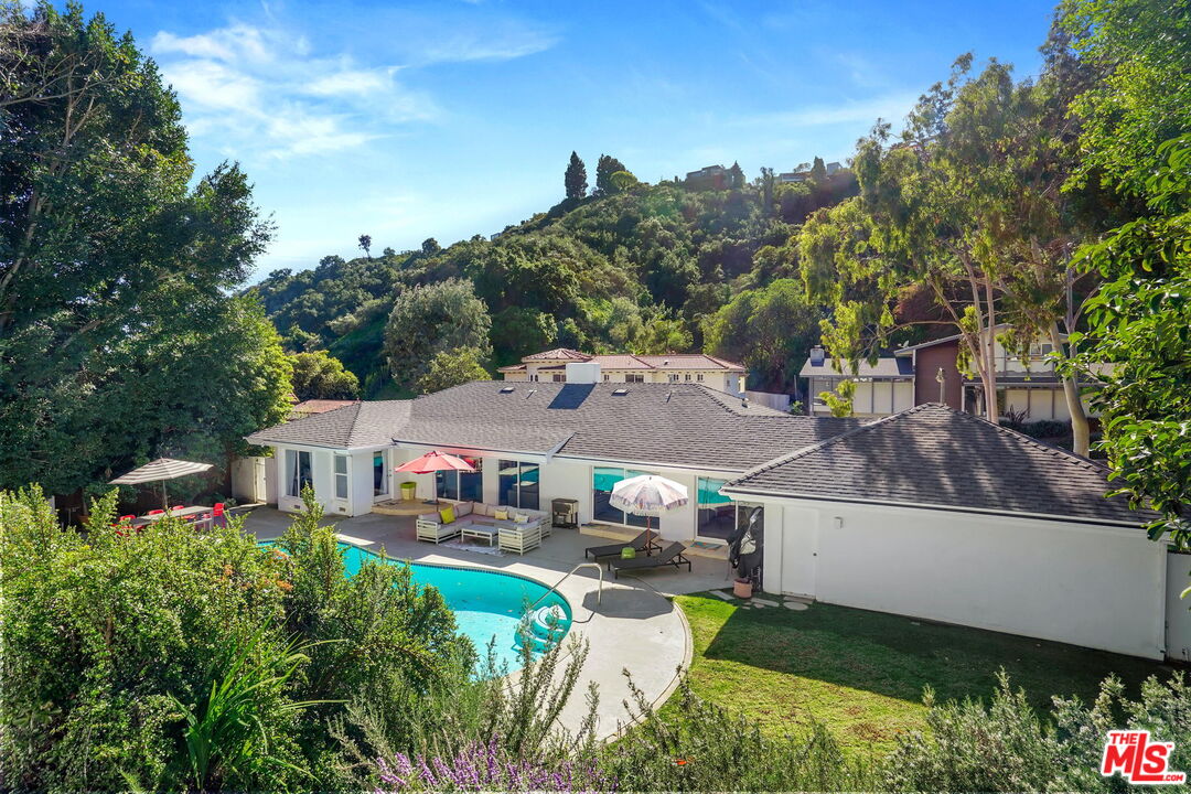 1066 Chantilly Road Los Angeles, CA 90077 - Photo 11 of 12 an aerial view of a house with garden space sitting space and swimming pool