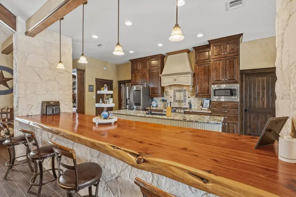 a very nice looking kitchen with a large window