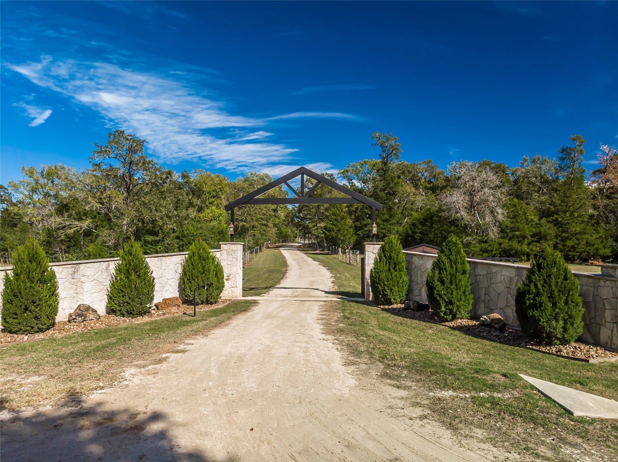 4999 Pin Oak Road Franklin, TX 77856 - Photo 3 of 47 a view of a street with a building in the background